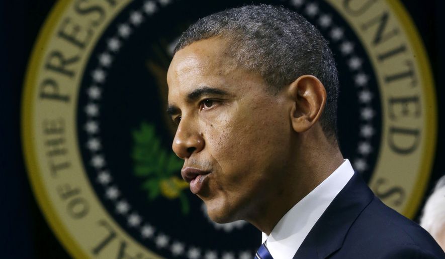 With the presidential seal on the wall behind him, President Barack Obama gestures as he speaks in the Eisenhower Executive Office Building, on the White House campus in Washington, Wednesday, Nov. 28, 2012, about how middle class Americans would see their taxes go up if Congress fails to act to extend the middle class tax cuts. The president said he believes that members of both parties can reach a framework on a debt-cutting deal before Christmas. (AP Photo/Pablo Martinez Monsivais)